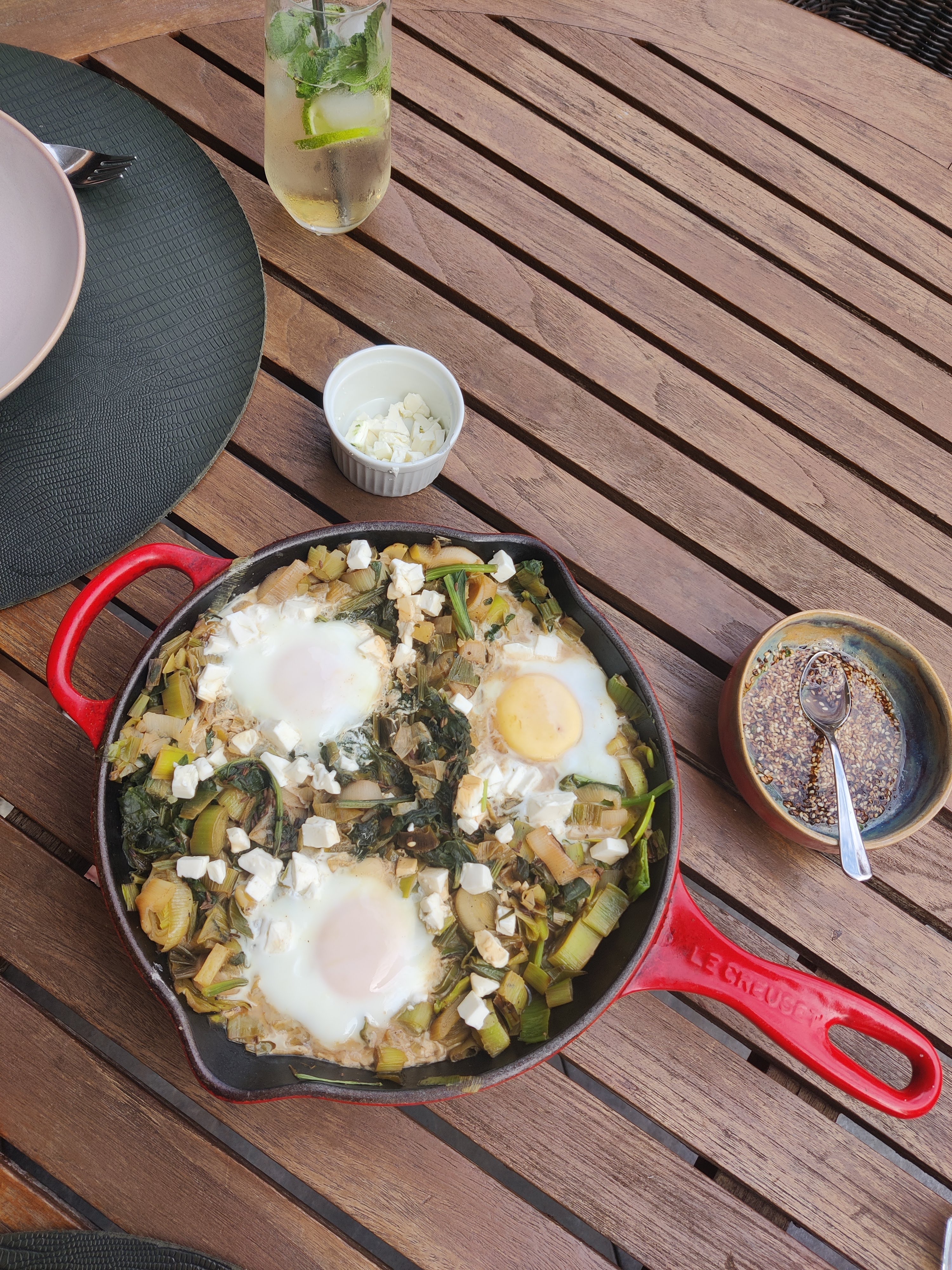 Braised eggs with leek and za’atar